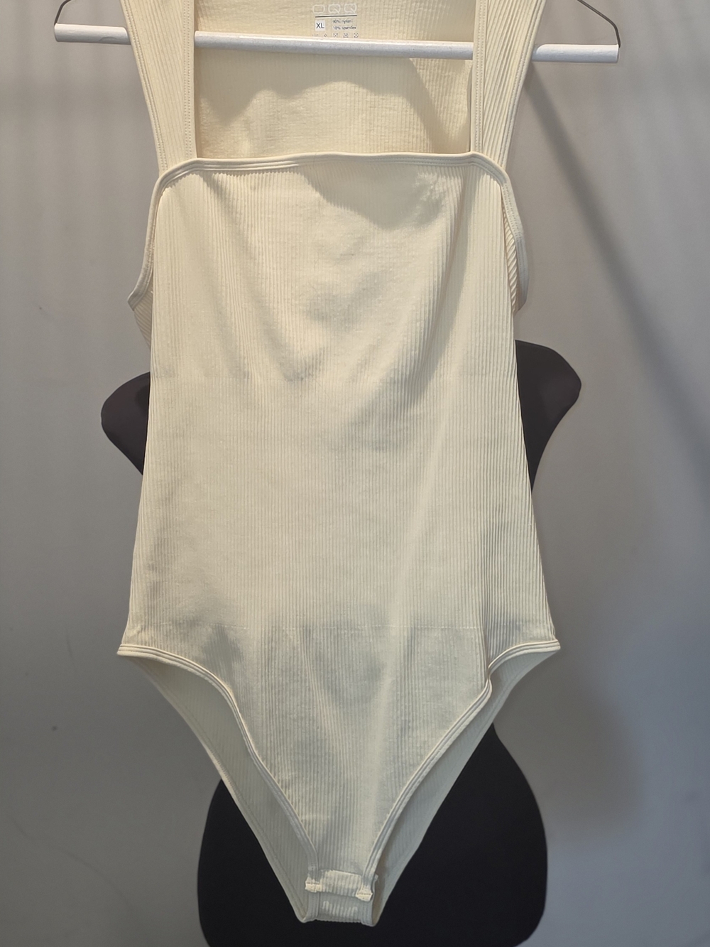 OQQ Ribbed Ivory One-Piece Bodysuit